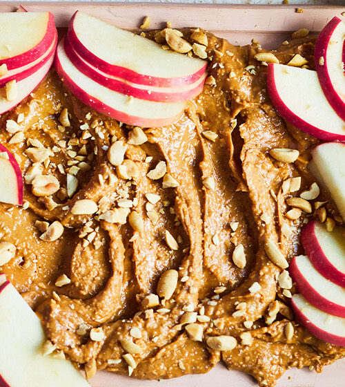 Proper Nutty Peanut Butter board with Pink Lady® apple slices